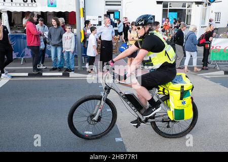 Ambulance,health,worker,support,staff,female,woman,on,bicycle,cyclist,support,crew,Runner,Runners,at,Cardiff,5K,five kilometres, road,run,running,race,South,Wales,Welsh,GB,Great Britain,British,UK,United Kingdom,Europe,European, Stock Photo