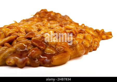 almonds caramelized prepare on restaurant kitchen isolate on white Stock Photo
