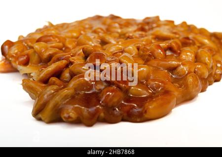 almonds caramelized prepare on restaurant kitchen isolate on white Stock Photo