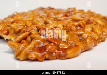 almonds caramelized prepare on restaurant kitchen isolate on white Stock Photo