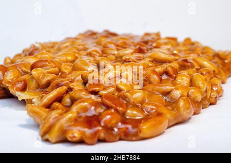almonds caramelized prepare on restaurant kitchen isolate on white Stock Photo