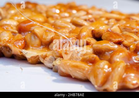 almonds caramelized prepare on restaurant kitchen isolate on white Stock Photo