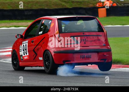 A dramatic entry to Druids, James Levy, FIAT Punto Abarth, 750MC HITEK Alfa Romeo Championship, Festival Italia, Brands Hatch, Fawkham, Kent, England, Stock Photo