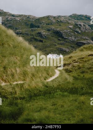 A lone typical white croft on the remote peninsula of Ardnamurchan, in Lochaber, West Highlands, Scotland UK - Scotland croft architecture landscape Stock Photo