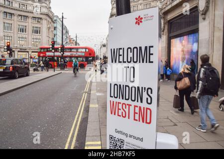 London, UK 17th December 2021. 'Stay Safe' signs with hand sanitisers have been installed in Oxford Street and Regent Street as the Omicron variant of COVID-19 spreads in the UK. Credit: Vuk Valcic / Alamy Live News Stock Photo