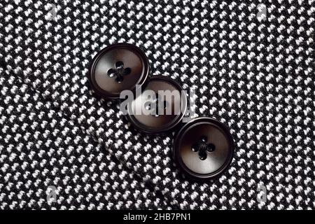 Black Button on Tweed Suit Stock Photo