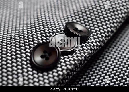 Black Button on Tweed Suit Stock Photo