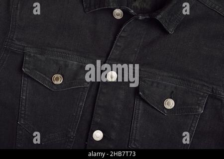 Close Up Detail on Black Denim Jacket Stock Photo