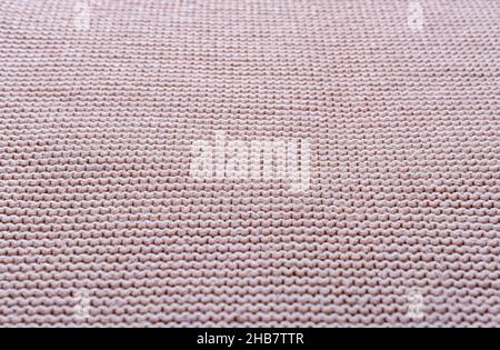 Knitted fabric texture. The pattern is clearly visible. Stock Photo