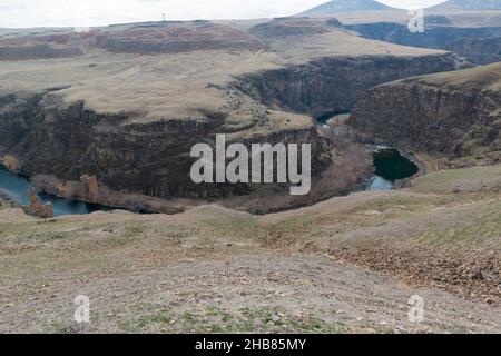 The closed border between Armenia and Turkey formed by the ravine of the Akhurian River at ruined medieval Armenian city Ani.  View from Turkish side. Stock Photo