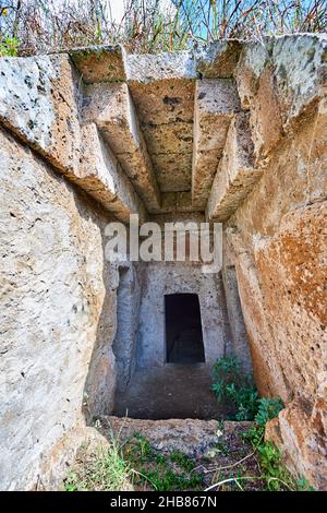 Domos (entrance corridor) to an Etruscan tumulus tomb cut into Tuff volcanic , Necropoli della Banditaccia, Cerveteri, Italy. A UNESCO World Heritage Stock Photo