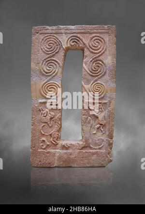 Mycenaean Garve stele with spiral relief and men hunting lions, 1600 - 1500 BC, Grave R Mycenae. Archaeological site Museum Mycenae. The top half of t Stock Photo