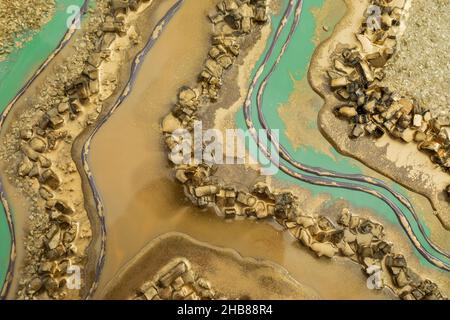 Resin art texture with golden colors and glass. Stock Photo
