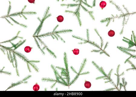 Christmas still life with fir branches and red decoration on white background. Flat lay, top view Stock Photo