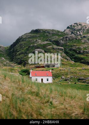 A lone typical white croft on the remote peninsula of Ardnamurchan, in Lochaber, West Highlands, Scotland UK - Scotland croft architecture landscape Stock Photo