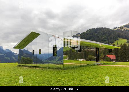 Gstaad, Switzerland - September 07, 2020: The mirror house by Doug Altken on the Swiss Alps to reflection landscape Stock Photo