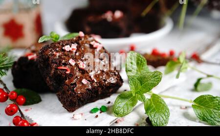 Homemade Peppermint fudge brownies on xmas holiday background, selective focus Stock Photo