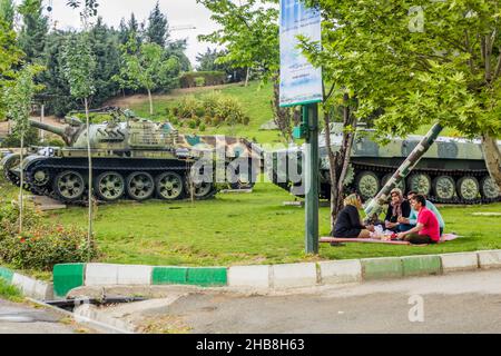 TEHRAN, IRAN - APRIL 14, 2018: Local people having picnic among exhibits of Holy Defense Museum in Tehran, Iran Stock Photo