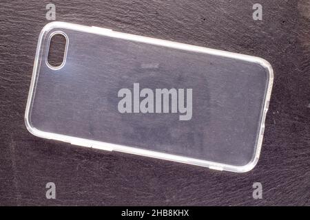 One silicone smartphone case on a slate stone, close-up, top view. Stock Photo