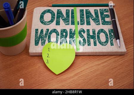 Conceptual display Online Workshop. Conceptual photo shows of goods and commodities over the electronic websites Plain Blank Open Notebooks With Stack Stock Photo