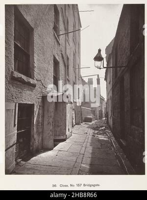 Bridgegate in Glasgow, Close, No. 157 Bridgegate (title on object), Old Closes and Streets of Glasgow (series title), Thomas Annan (attributed to), Glasgow, 1868 - 1877, photographic support, cardboard, carbon print, height 285 mm × width 233 mmheight 440 mm × width 310 mm Stock Photo