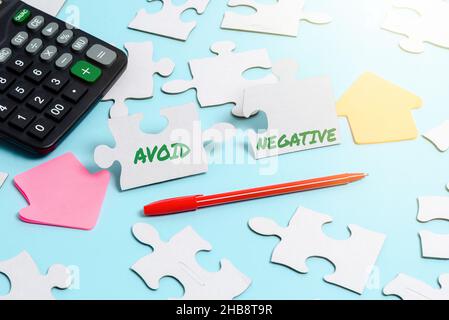 Hand writing sign Avoid Negative. Internet Concept Staying away from pessimistic showing Suspicious Depression Building An Unfinished White Jigsaw Stock Photo