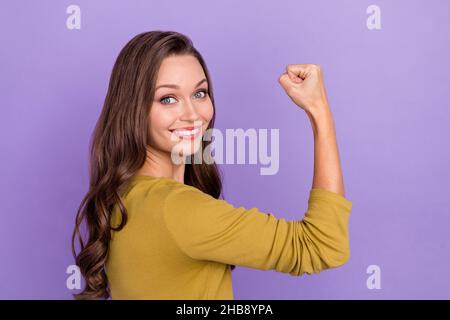 Profile portrait of candid friendly person hand showing flexing biceps isolated on purple color background Stock Photo
