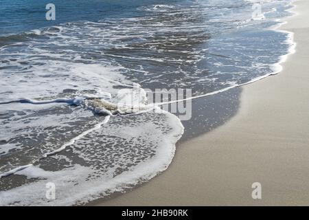 soft waves and refreshing sea water on the sandy beach beautiful mediterranean coast Stock Photo