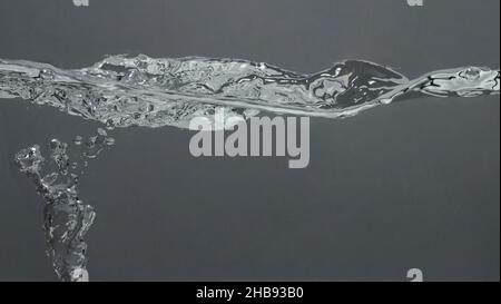 Soda water bubble splashing and floating drop. Represent sparkling and refreshing. Close up soda water bubbles floating up to top of water surface on Stock Photo