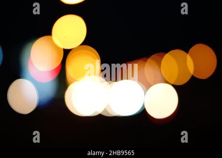 Abstract bokeh background, circles of light on dark background Stock Photo