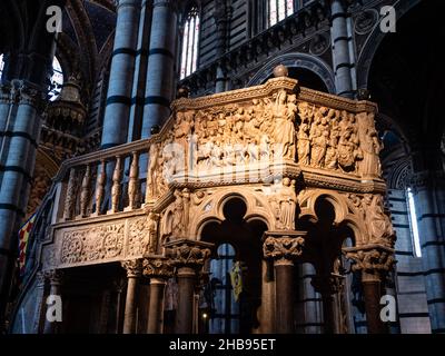 Siena, Italy - August 15 2021: Pulpit in Siena Cathedral made from Carrara Marble in Gothic Style by Nicola Pisano Stock Photo