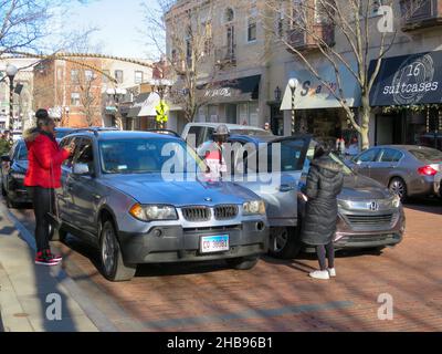 Automobile accident scene. Driver of parked car opened door into passing traffic resulting in door being hit. Oak Park, Illinois. Stock Photo