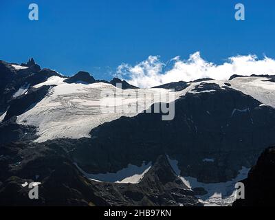 Peak of Mt Titlis with snow from Engelberg in summer, Switzerland Stock Photo