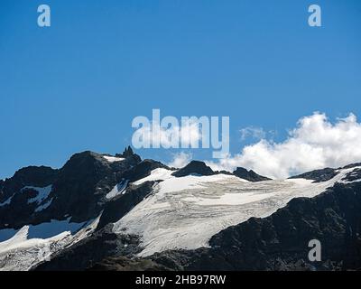 Peak of Mt Titlis with snow from Engelberg in summer, Switzerland Stock Photo