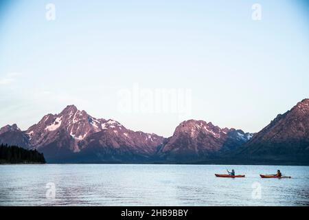 Two kayakers on Jackson Lake in Wyoming Stock Photo
