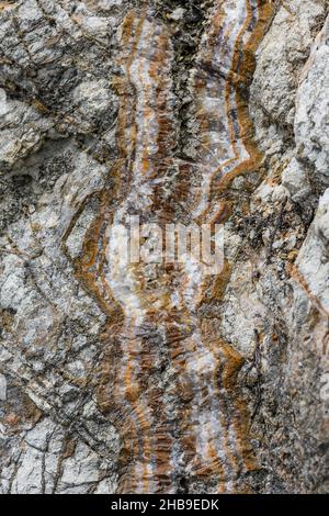 Quartz and agate vein fills the fracture in volcanic rock. Ecuador, South America. Stock Photo
