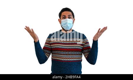 Surprised man indicates with two hands to the top while using face mask safe from coronavirus isolated on white background. Concept of Covid-19 pandem Stock Photo