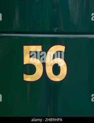 Number 56 in gold painted on a green vehicle/truck Stock Photo