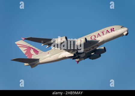 QATAR Airways Airbus A380-861 airliner jet plane A7-APE taking off from London Heathrow Airport, UK, in blue sky. Long haul air travel Stock Photo