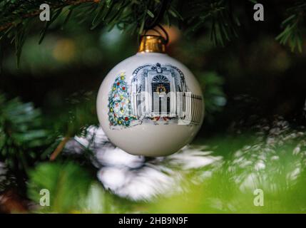 London, UK. 17th Dec, 2021. Detail of a Baubel hanging on the tree outside Number 10 Downing Street. The baubel shows the door of Number 10, 2 robins and a Christmas tree. There is controversy about an alleged Downing Street party. Credit: Tommy London/Alamy Live News Stock Photo