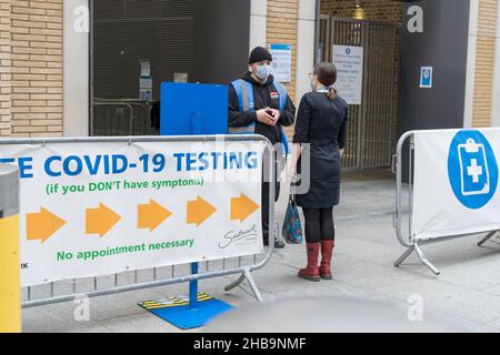 woman checks in with steward at Rapid COVID-19 Testing site London England Stock Photo