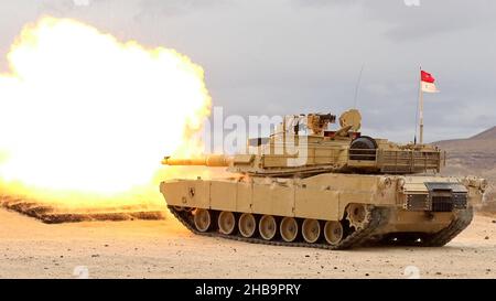 An M1A2 Abrams SEP V2 main battle tank, assigned to Cold Steel Troop, 1st Squadron, 11th Armored Cavalry Regiment, fires a M865 target practice cone stabilized discarding sabot with tracer on December 9, 2021, at the National Training Center and Fort Irwin training area. Stock Photo