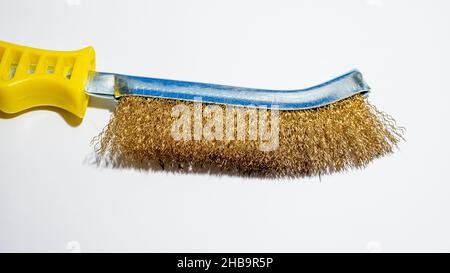 Hand brush for grinding metal. Metal wire brush isolated on white background copy space Stock Photo