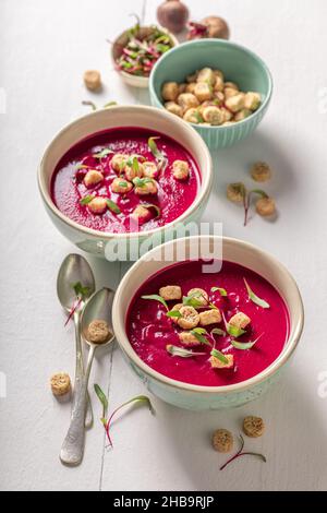 Veggie borsch soup as a classic Polish soup. Cream of beetroot with cream. Stock Photo