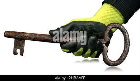Manual worker with protective work gloves holding a large rusty ancient key, isolated on white background. Stock Photo