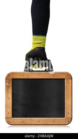Manual worker with protective work gloves, holding an old blank blackboard with wooden rectangular frame and nails in the shape of a briefcase. Stock Photo
