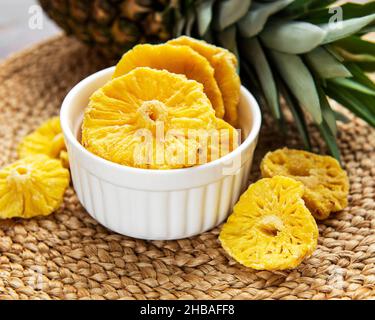 Pineapple dried rings on a rustic background Stock Photo