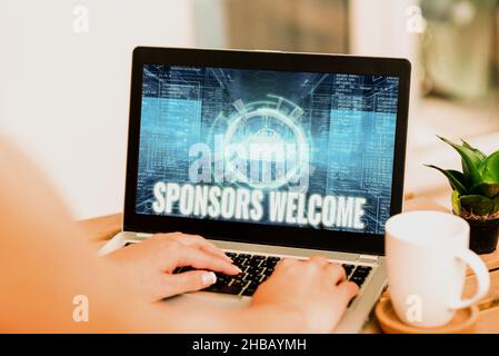 Conceptual caption Sponsors Welcome. Business overview announcing that you accept investing in your company Hand Typing On Laptop Next To Coffee Mug Stock Photo