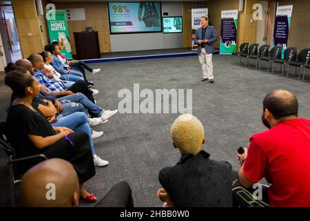 JOHANNESBURG, SOUTH AFRICA - Oct 22, 2021: An educator instructing diverse adult students on personal finance in Johannesburg, South Africa Stock Photo