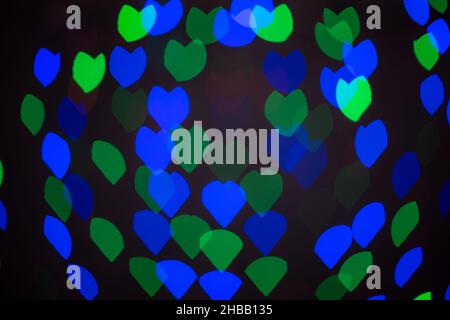 Creative background of glowing blurred hearts in blurred key for nostalgic love and romantic themes. Stock Photo